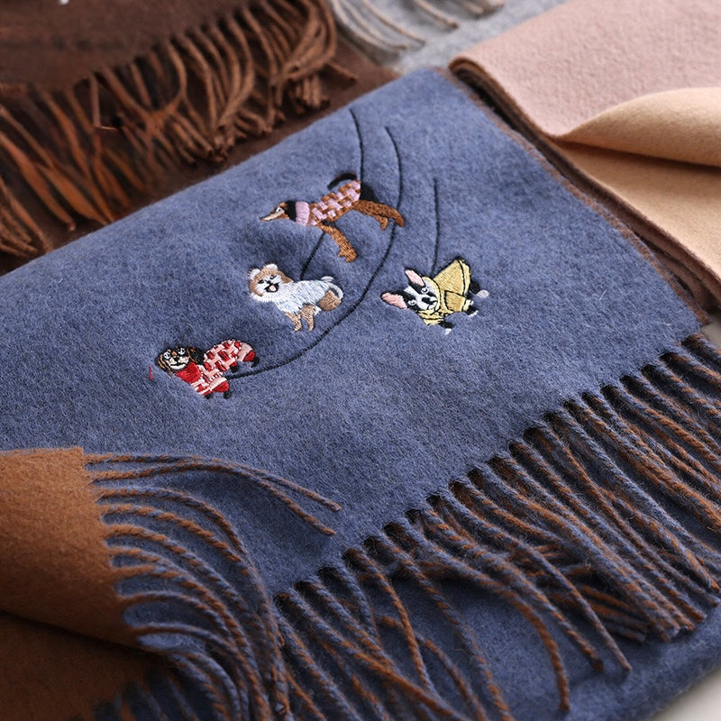 Blue scarf with embroidered dog designs